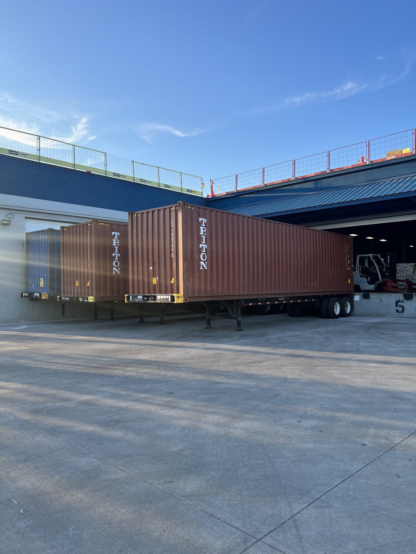 Loaded shipping containers at US Dynamics facility ready for export