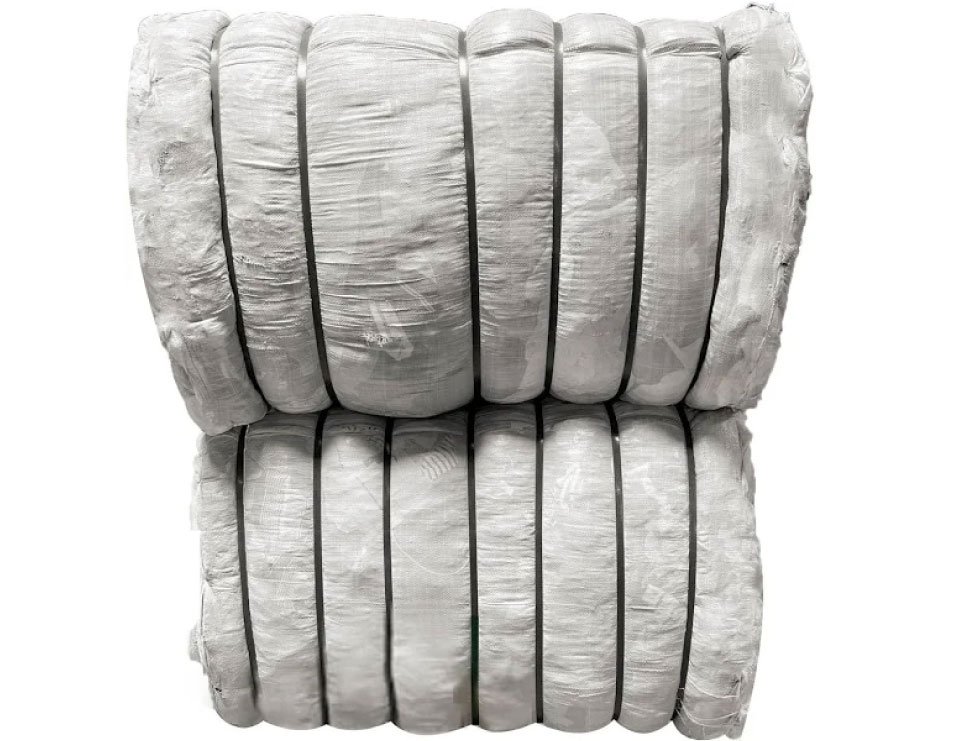 Bales of used clothing at US Dynamics warehouse prepared for wholesale export